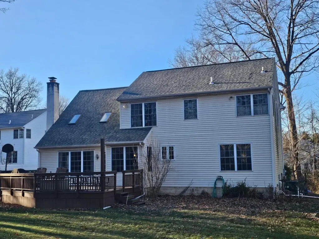 Completed asphalt shingle roof on suburban two-story home — Discounted Roofing LLC Philadelphia