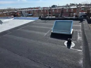 Flat rubber roof with skylight and vent pipe, Philadelphia — Discounted Roofing LLC