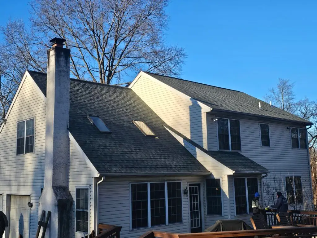 New asphalt shingle roof on two-story home with skylights — Discounted Roofing LLC Philadelphia